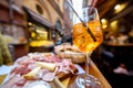 Italian meat plate and drink on table at outdoor bar Royalty Free Stock Photo