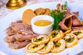 Meat platter with sliced ham, cold boiled pork, rolled stuffed chicken, seitan Royalty Free Stock Photo