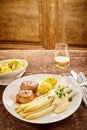 Meat and potatoes with asparagus and wine Royalty Free Stock Photo