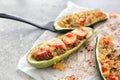 Meat and quinoa stuffed zucchini boats on light table Royalty Free Stock Photo