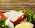 Meat raw chicken leg garlic greens lemon rosemary dish, red chili pepper, nutrition tomato Royalty Free Stock Photo