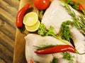 Meat raw chicken leg greens lemon rosemary, red chili pepper, nutrition tomato Royalty Free Stock Photo