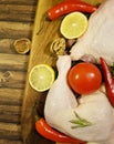 Meat raw chicken leg still life, spicegreens, red pepper rustic uncooked , dish table tomato, lemon garlic, pomegranate nutrition Royalty Free Stock Photo