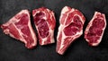 Meat raw steak lies on a black background. top view Royalty Free Stock Photo