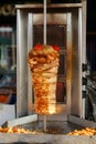 Meat roasted on a vertical spit Royalty Free Stock Photo