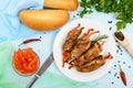 Meat rolls stuffed with sweet pepper, carrots on a light background. Royalty Free Stock Photo