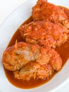 Meat roulade in tomato sauce.