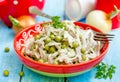 Meat salad with canned green peas and onion