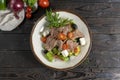 Meat salad with roast beef and feta cheese. Cold appetizer of lettuce leaves, cherry tomatoes, beef, veal or pork, feta cheese and Royalty Free Stock Photo