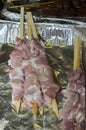 Meat sausages on wooden skewers in ÃÂ°luminium packaging