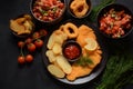 Meat schnitzel and fried potatoes with onion rings deep fried Royalty Free Stock Photo