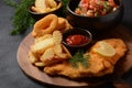 Meat schnitzel and fried potatoes with onion rings deep fried Royalty Free Stock Photo