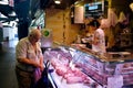 Meat seller La Boqueria Market in Barcelona, Spain