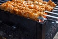 Meat skewers grill. Pork or beef are fried on open fire. Barbecue kitchen party close up image. Kebab or shashlik cooking on spits Royalty Free Stock Photo