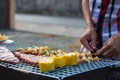 Meat and skewers ingredients for barbecue party are placed on grill to cook barbecue and make it ready for family to join barbecue Royalty Free Stock Photo