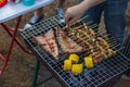 Meat and skewers ingredients for barbecue party are placed on grill to cook barbecue and make it ready for family to join barbecue Royalty Free Stock Photo