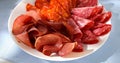 meat slices on a plate. traditional spanish sausage with beef jerky. salchichon, chorizo and prosciutto Royalty Free Stock Photo