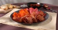 meat slices on a plate. traditional spanish sausage with beef jerky. Royalty Free Stock Photo