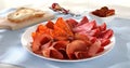 meat slices on a plate. traditional spanish sausage with beef jerky. salchichon, chorizo and prosciutto Royalty Free Stock Photo