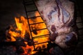 Meat on the spit or asado in the stake. Grill on the coals. Traditional Argentine barbecue