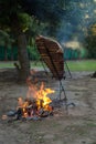 Meat on the spit or asado in the stake. Grill on the coals. Traditional Argentine barbecue Royalty Free Stock Photo