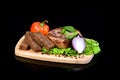 Meat steak with vegetables on a breadboard Royalty Free Stock Photo