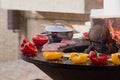 Meat, steaks and sausages with vegetables cooking on grill and smoldering coals. Barbecue Royalty Free Stock Photo