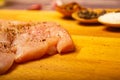 Meat steaks and various spices on a wooden Board. Close up