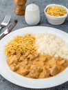 Meat strogonoff with rice and straw potato Royalty Free Stock Photo