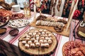 meat table at luxury wedding reception. ham,bacon,sausages,salami,prosciutto,lard on wooden desk. expensive catering Royalty Free Stock Photo