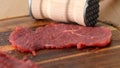 Meat Tenderizer and Raw Steak. Royalty Free Stock Photo