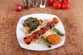 Meat and tomato kebabs with fresh peppercorns Royalty Free Stock Photo