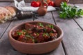 Meat in tomato sauce beef roast in a clay bowl Royalty Free Stock Photo