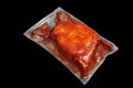 Meat in a vacuum-sealed cooking bag