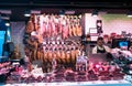 Meat vendor at Boqueria market, Barcelona, Spain