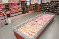 Meat and wine department. Grocery shop shelves with products inside a grocery store market in Rome in Italy