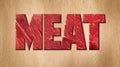Meat word covered with raw meat texture on a wooden cutting board