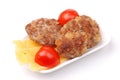Meatball, cheese and tomatoes on a plate