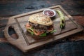 Meatball Sandwich with tomatoes, onion and green pepper on rustic wooden background Royalty Free Stock Photo