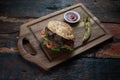 Meatball Sandwich with tomatoes, onion and green pepper on rustic wooden background Royalty Free Stock Photo