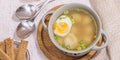 Meatball soup with boiled egg, ditalini pasta, vegetables and fresh herbs. Healthy chicken broth Royalty Free Stock Photo