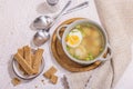 Meatball soup with boiled egg, ditalini pasta, vegetables and fresh herbs. Healthy chicken broth Royalty Free Stock Photo