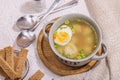 Meatball soup with boiled egg, ditalini pasta, vegetables and fresh herbs. Healthy chicken broth Royalty Free Stock Photo