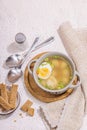 Meatball soup with boiled egg, ditalini pasta, vegetables and fresh herbs. Healthy chicken broth Royalty Free Stock Photo