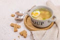 Meatball soup with boiled egg, ditalini pasta, vegetables and fresh herbs. Healthy chicken broth Royalty Free Stock Photo