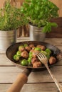 meatballs with cabbage and basil in a pan