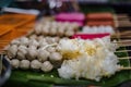 Meatballs and jellyfish skewers ready to be fried for sale at the Chak Ngaew Chinese Community Market