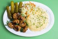 Meatballs with mashed potatoes pickles  in a plate bowl with greens vegetables Royalty Free Stock Photo