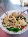 Meat ball soup with Indonesian tofu, dumplings and noodles called Baso