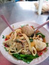 Meat ball soup with Indonesian tofu, dumplings and noodles called Baso
